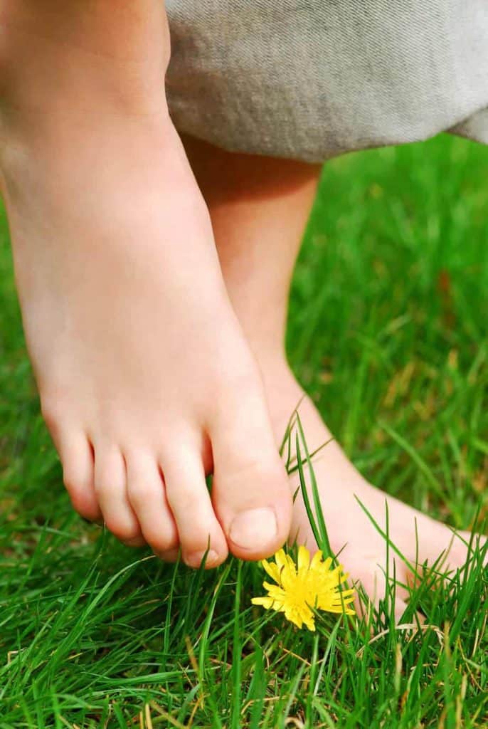 barefoot earthing on grass